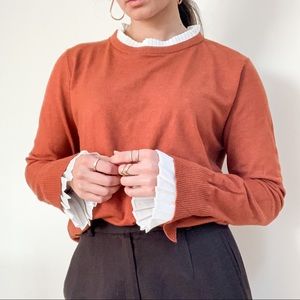 burnt orange ruffle sleeves